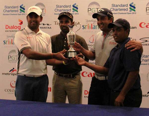 Outside-lead-Professional-Golfers-with-the-Standard-Chartered-Open-2012-trophy